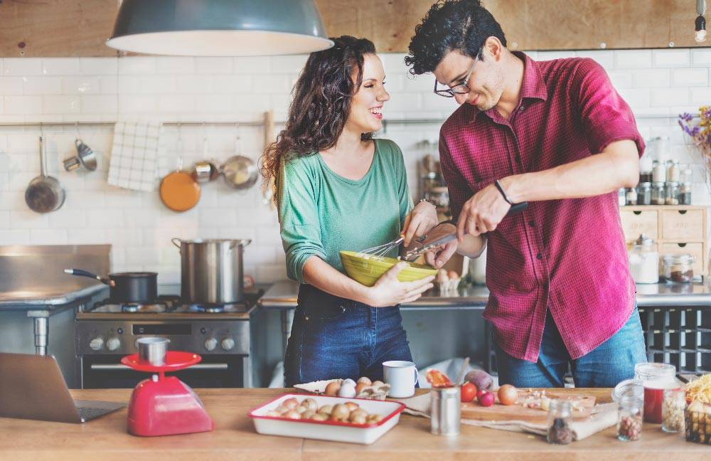 couple_cooking_together Couple cooking together in kitchen
